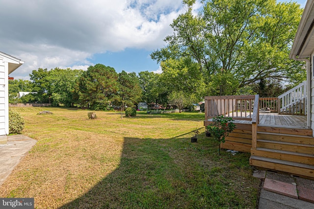 view of yard featuring a wooden deck