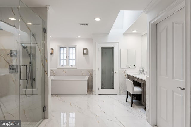 bathroom with plus walk in shower, vanity, and crown molding