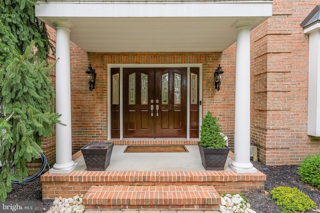 doorway to property with covered porch