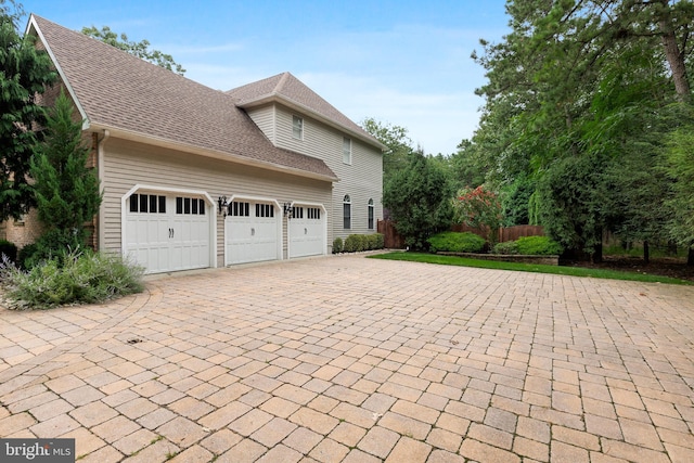 view of property exterior with a garage