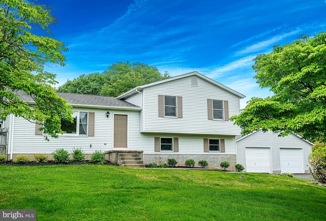 tri-level home with a front lawn, an outbuilding, and a garage