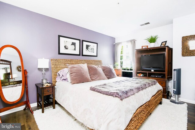 bedroom featuring hardwood / wood-style flooring