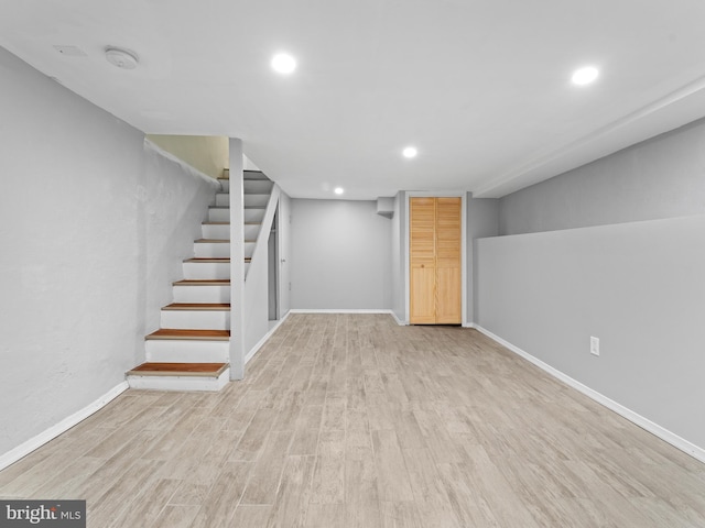 basement featuring light wood-type flooring