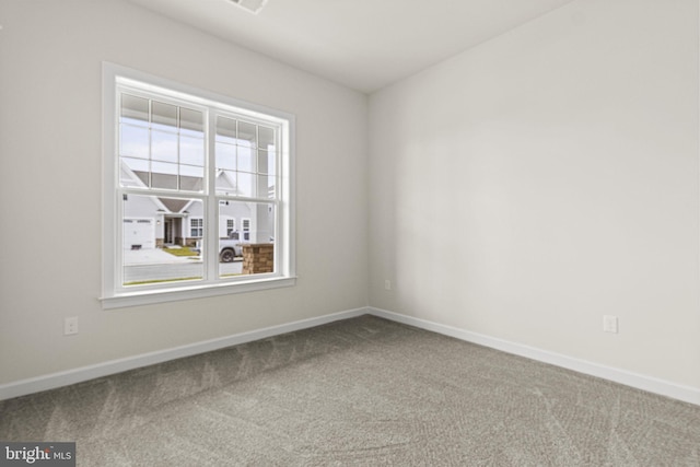 unfurnished room with carpet floors