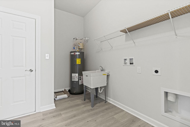 clothes washing area with light wood-type flooring, water heater, hookup for an electric dryer, and washer hookup