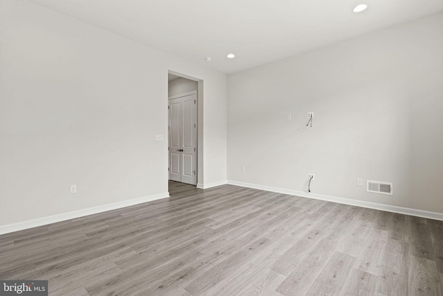 unfurnished room with light hardwood / wood-style flooring