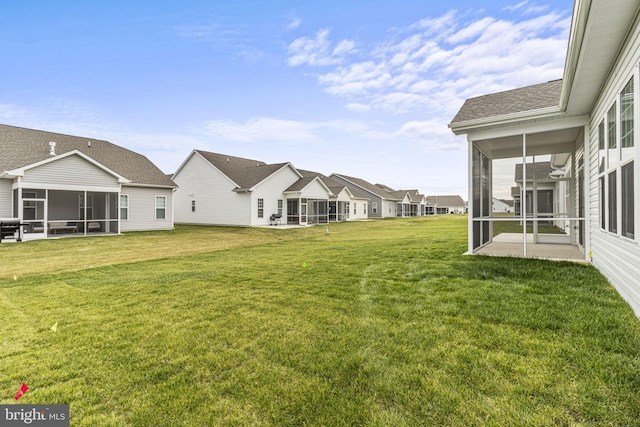 view of yard featuring a sunroom