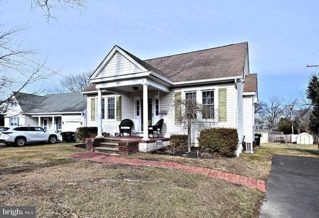 view of front of home with a garage and a porch