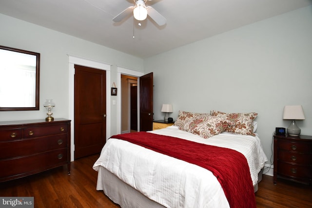 bedroom with ceiling fan and dark hardwood / wood-style floors