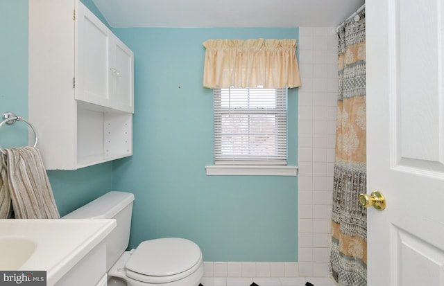 bathroom featuring toilet and vanity