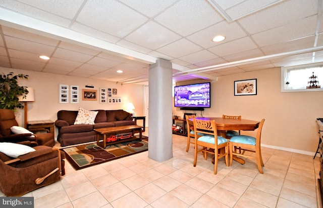 interior space featuring a paneled ceiling and decorative columns