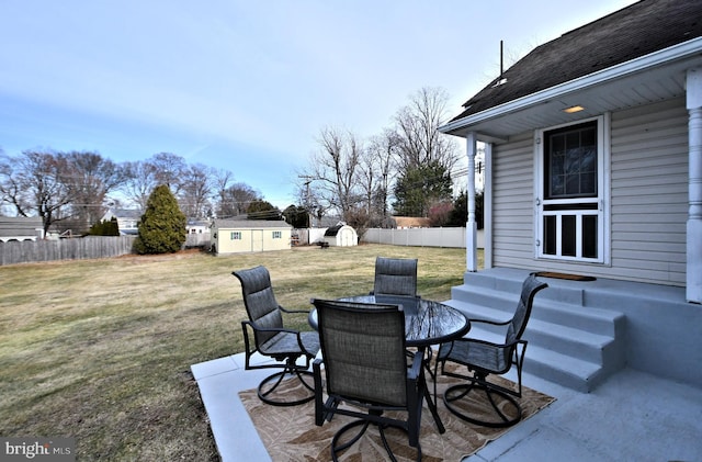 view of patio featuring a storage unit