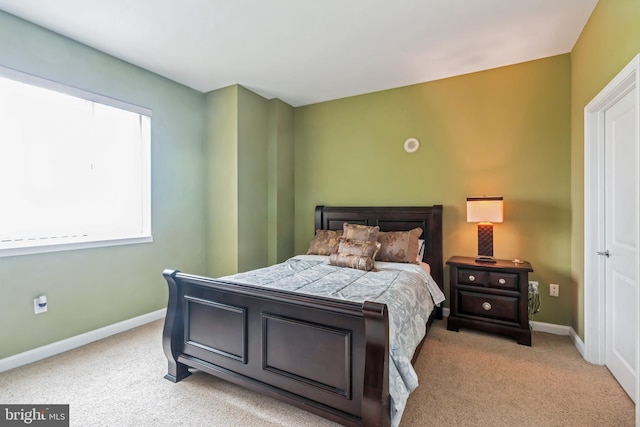 bedroom with light carpet