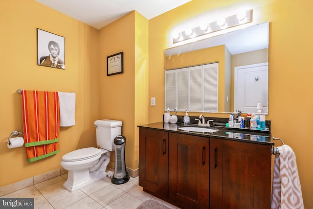 bathroom featuring vanity, toilet, and tile patterned floors