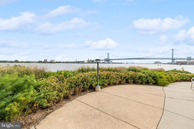 view of patio featuring a water view