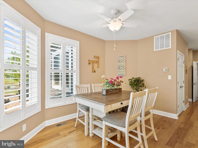 dining space featuring light hardwood / wood-style floors and ceiling fan