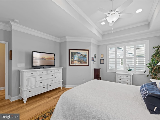 bedroom with light hardwood / wood-style flooring, ceiling fan, and crown molding