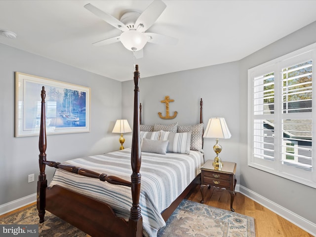 bedroom featuring wood-type flooring and ceiling fan