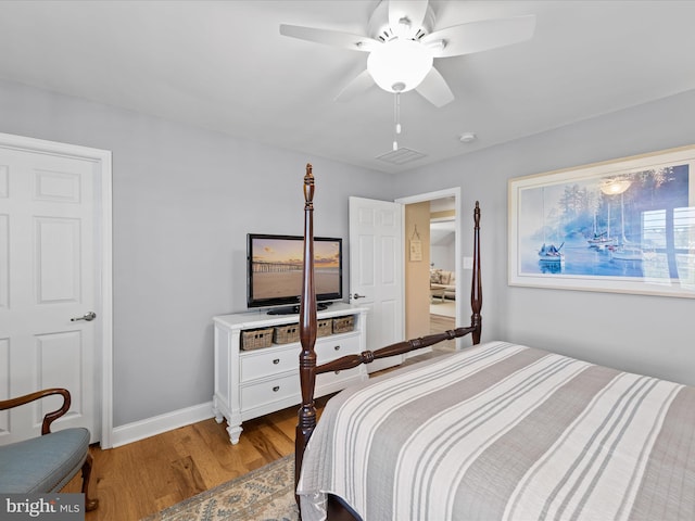 bedroom with light wood-type flooring and ceiling fan