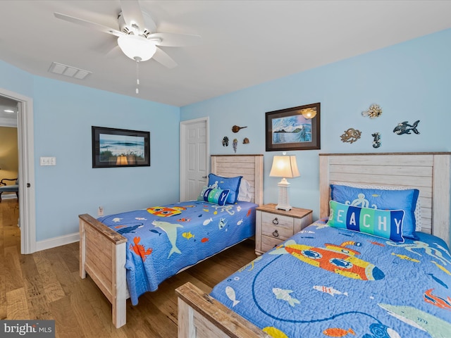 bedroom featuring hardwood / wood-style floors and ceiling fan