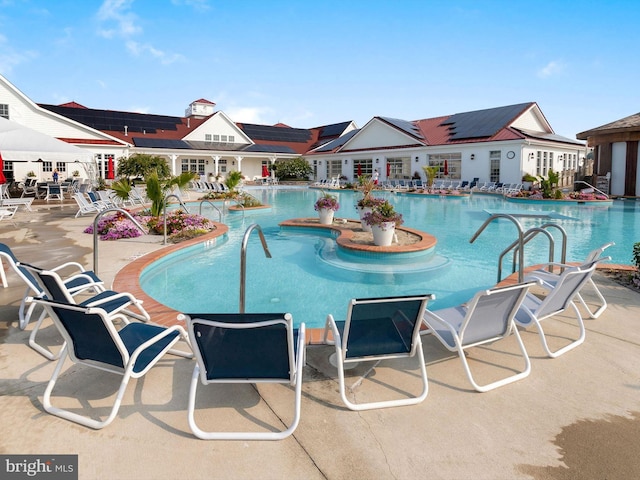 view of swimming pool with a patio area