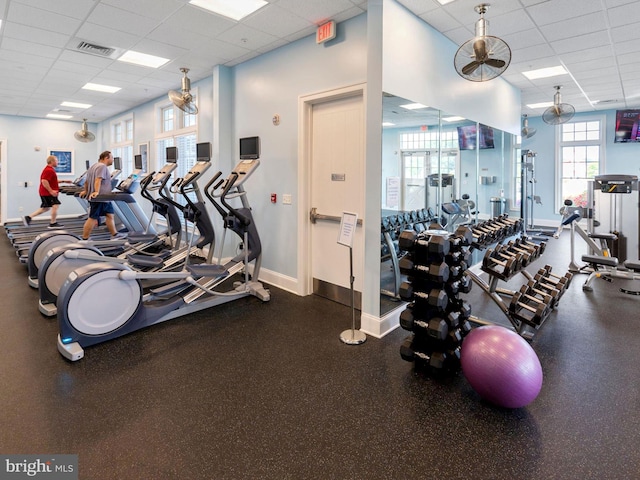 gym featuring a drop ceiling