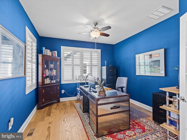 office area featuring light hardwood / wood-style floors and ceiling fan