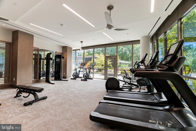 hall featuring light tile patterned flooring and elevator