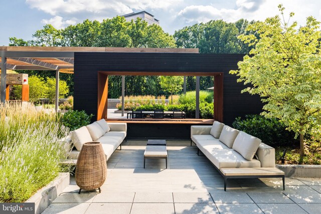 view of patio with a pergola and an outdoor hangout area