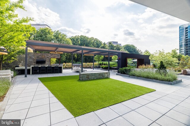 view of patio / terrace with a pergola and an outdoor living space