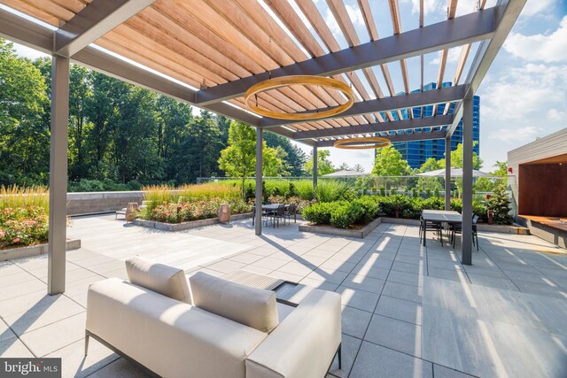 view of community featuring an outdoor living space, a pergola, a patio, and a lawn