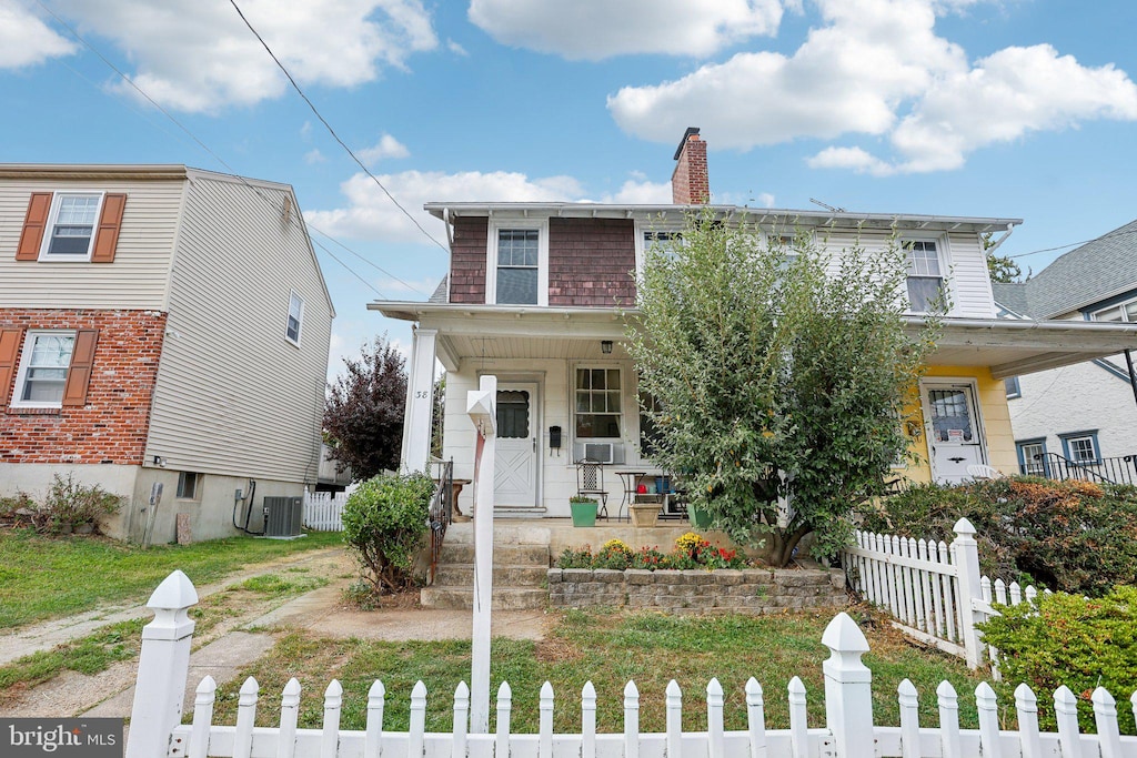 view of front of property with central AC unit and covered porch