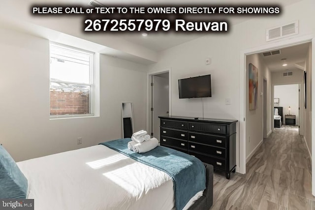 bedroom featuring hardwood / wood-style flooring