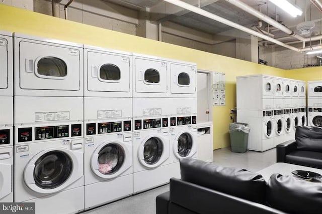 laundry area with washing machine and dryer and stacked washing maching and dryer