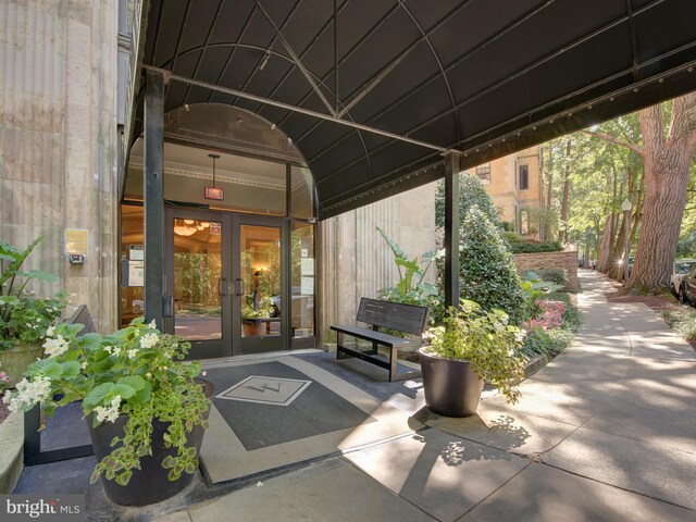 view of exterior entry featuring french doors