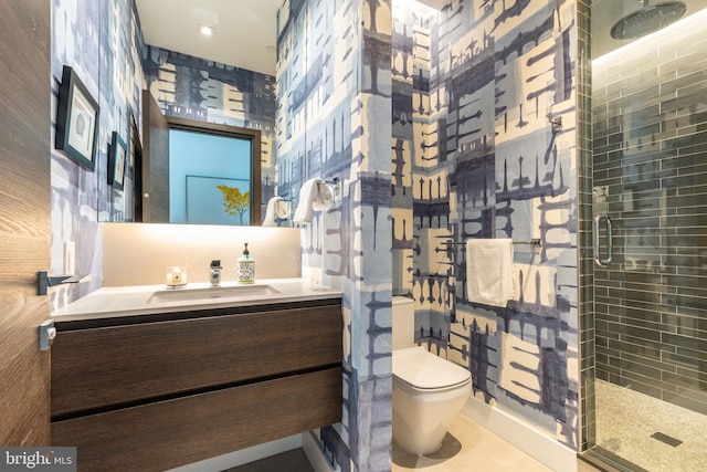 bathroom featuring walk in shower, tile patterned flooring, vanity, and toilet