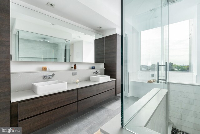 bedroom featuring floor to ceiling windows and light hardwood / wood-style floors