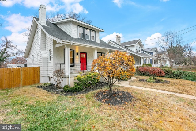 view of front of home featuring a porch and a front lawn