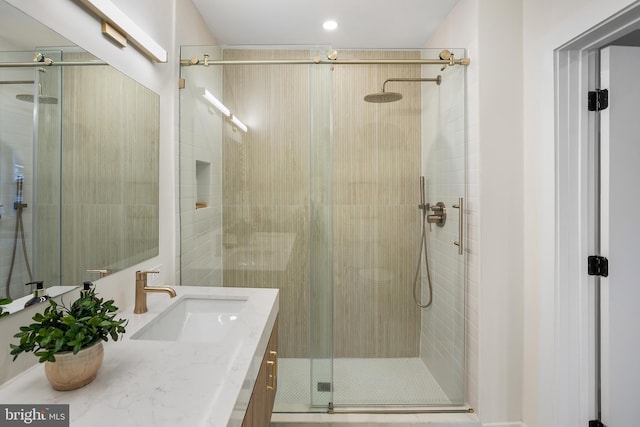 bathroom featuring vanity and walk in shower