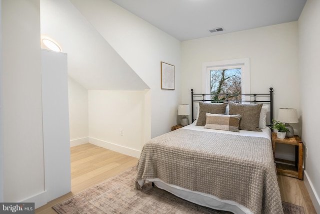 bedroom featuring hardwood / wood-style floors