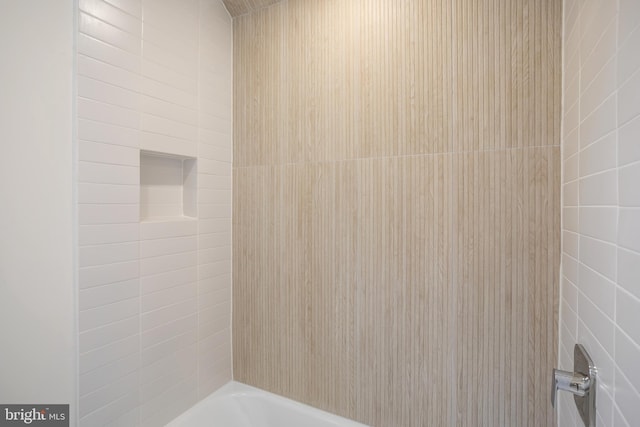 bathroom with shower / bathtub combination