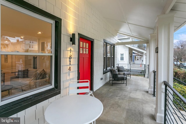 property entrance with covered porch