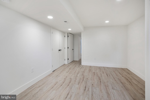 spare room with visible vents, recessed lighting, baseboards, and light wood finished floors