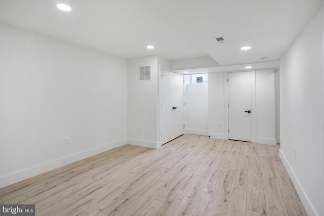 empty room with recessed lighting, visible vents, baseboards, and light wood-style flooring