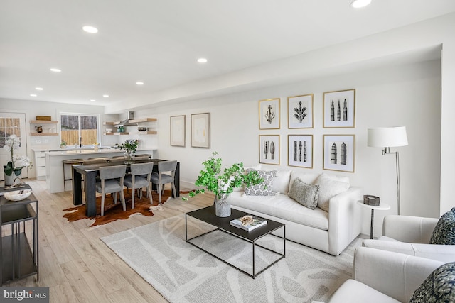 living room with recessed lighting and light wood finished floors