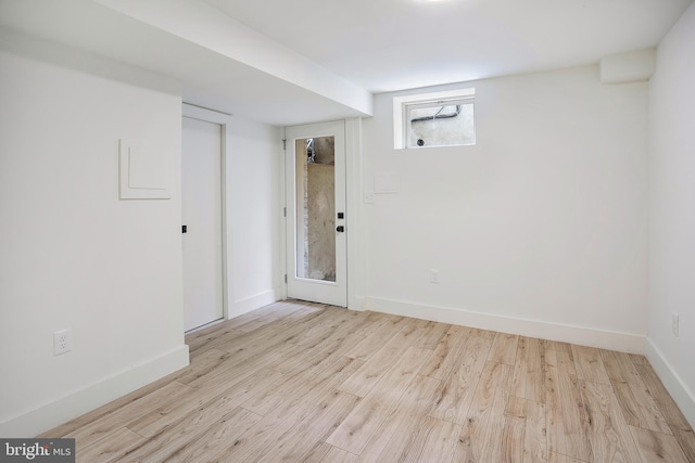 unfurnished room featuring wood finished floors and baseboards