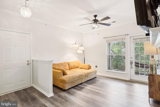 living room featuring ornamental molding, ceiling fan, and hardwood / wood-style flooring