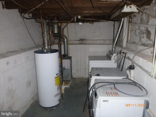 utilities with gas water heater and washing machine and dryer