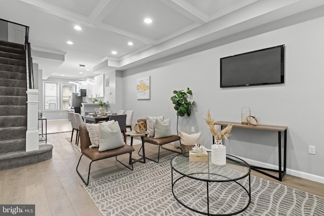 sitting room featuring coffered ceiling, beamed ceiling, hardwood / wood-style floors, and crown molding