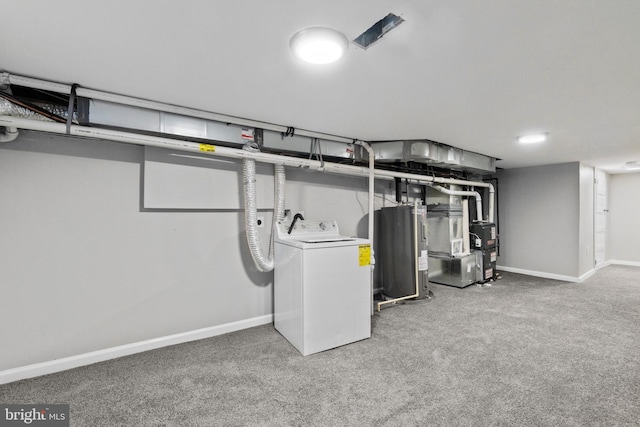 basement featuring heating unit, washer / clothes dryer, electric water heater, and carpet floors